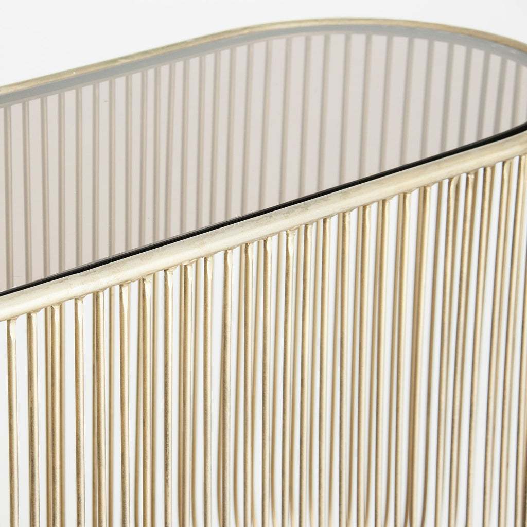 Goldene Konsole kombiniert mit einer ovalen Glasplatte - Maison Oudh