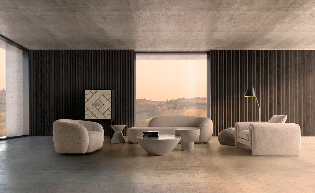 Runder Beistelltisch aus grauem Beton. 