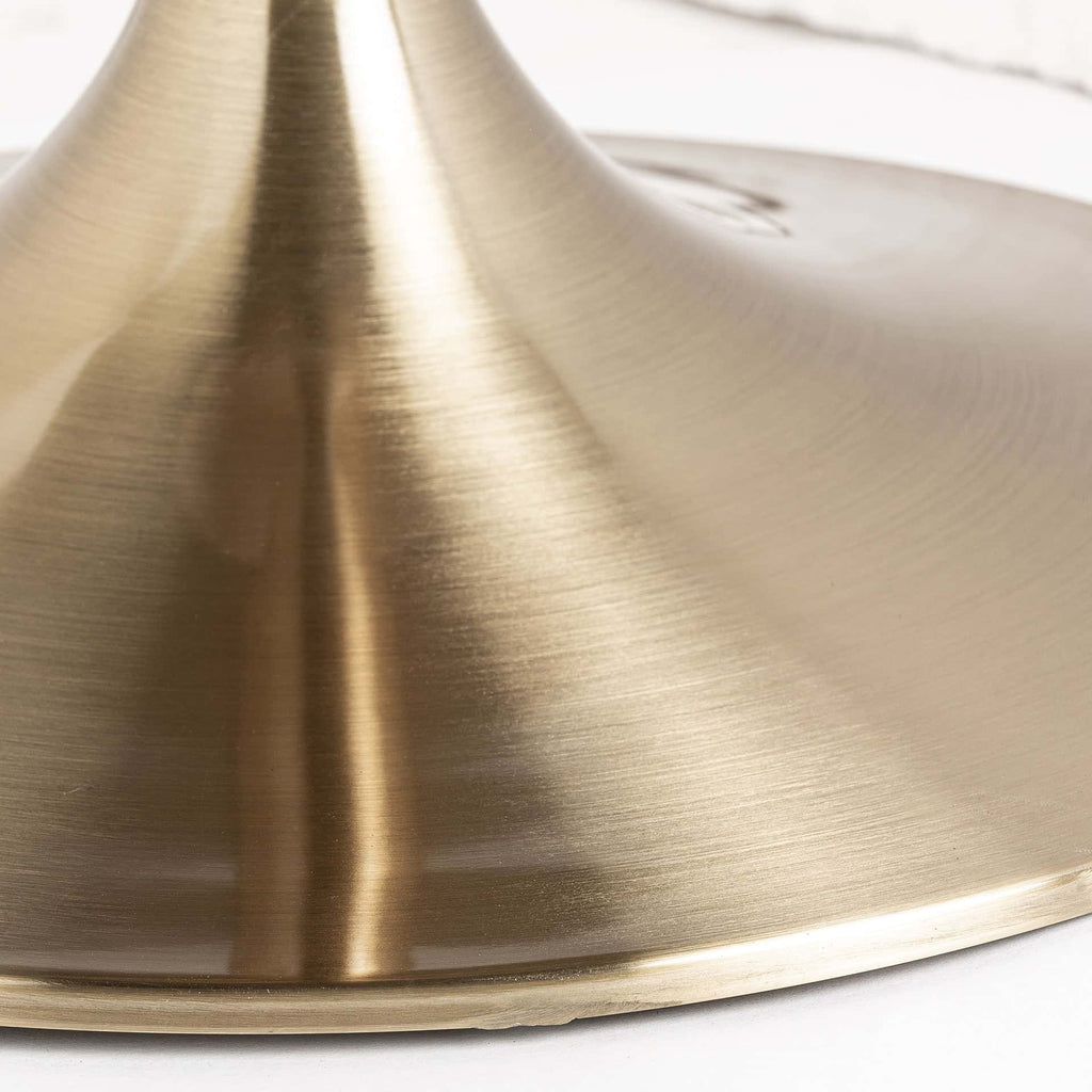 Runder Esstisch im Art Deco Stil mit einer schwarzen Keramikplatte kombiniert mit Gold - Maison Oudh